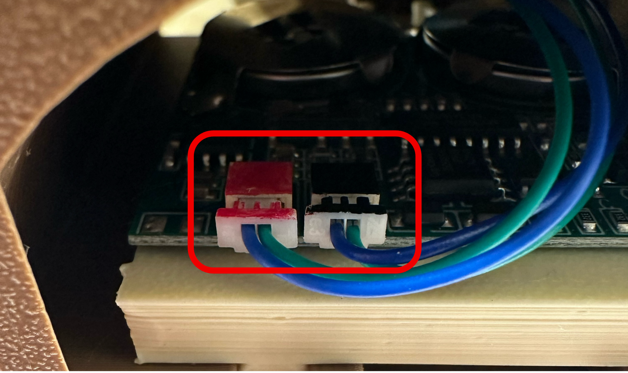 The black and red power connectors unplugged from the motherboard
